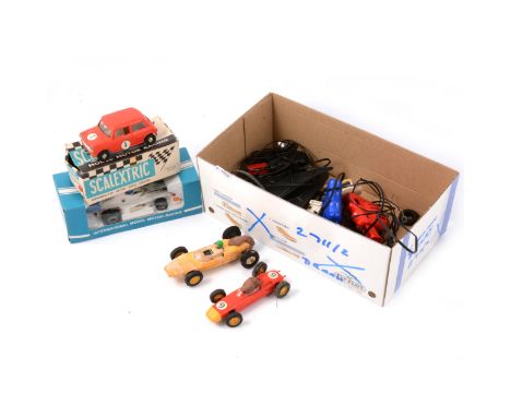 Scalextric slot-car racing, a collection to include C76 Mini Cooper, red body, no.1 stickers, boxed; C.012 Shadow, no.9 stick