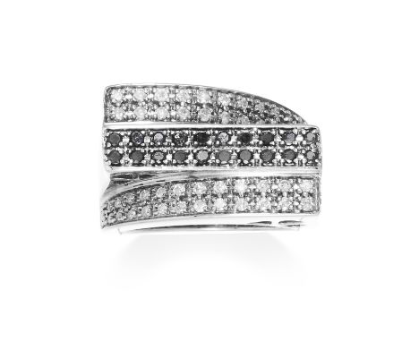 A BLACK AND WHITE DIAMOND DRESS RING in 9ct white gold, the twisted band set with three rows of white and black diamonds, tot