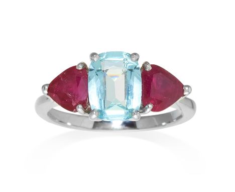 AN AQUAMARINE AND RUBY RING in white gold, the central cushion cut aquamarine, flanked by two rubies, unmarked, size N / 7, 4