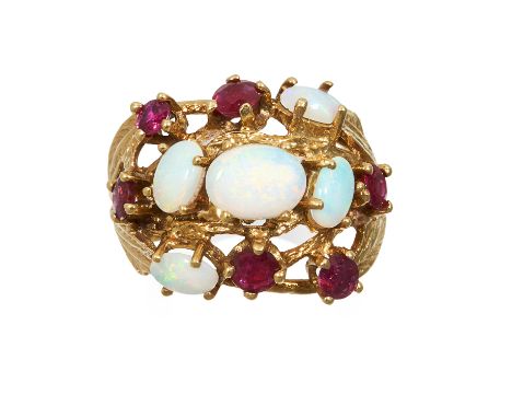 AN OPAL AND RUBY DRESS RING in high carat yellow gold, set with five cabochon opals and six round cut rubies, marked indistin