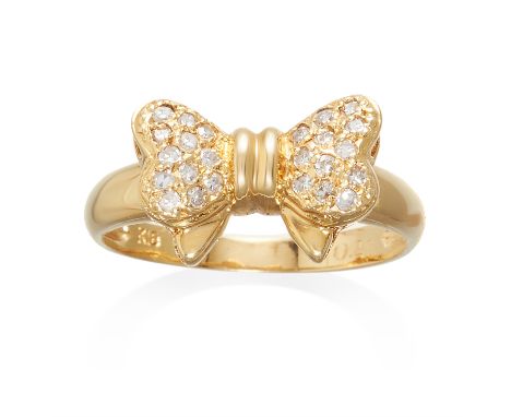 A DIAMOND BOW RING in 18ct yellow gold, comprising of a bow jewelled with round cut diamonds, stamped 18K, size M / 6, 2.6g.