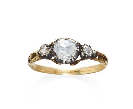 AN ANTIQUE THREE STONE ROSE CUT DIAMOND RING in yellow gold, set with a central rose cut diamond, unmarked, size P / 7, 2g.