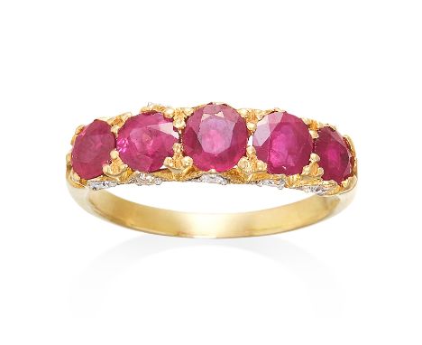 AN ANTIQUE RUBY AND DIAMOND RING in high carat yellow gold, the five graduated oval cut rubies totalling 2.10 carats, the gal