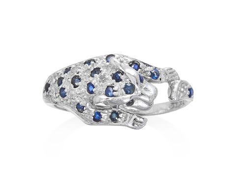 A SAPPHIRE PANTHER RING depicting a panther jewelled with round cut sapphires, unmarked, size M / 6.5, 2.27g.