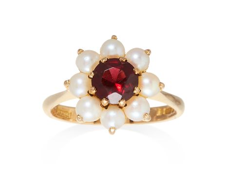 A PEARL AND GARNET CLUSTER RING in 9ct yellow gold, set with a central round cut garnet framed in a pearl cluster, British ha