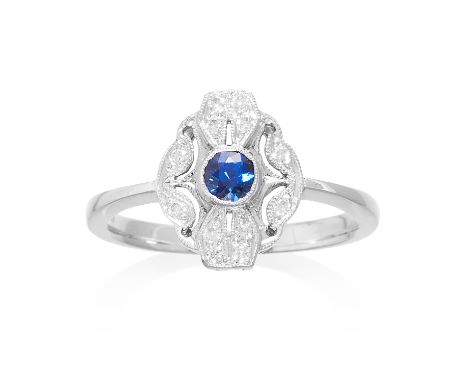 A SAPPHIRE AND DIAMOND DRESS RING in 18ct white gold, comprising of a round cut sapphire totalling approximately 0.27 carats 