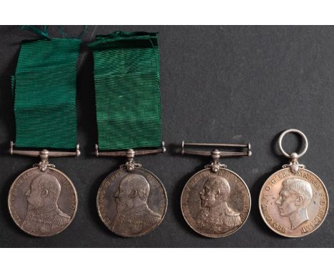 Four Royal Naval Reserve Long Service and Good Conduct Medals.'D1697 J Peters  Sean RNR''E 2089 G W Henderson, Seaman 1 Cl, R