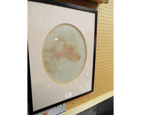 A 20thC red chalk portrait of a reclining dog, mounted and framed (unsigned)