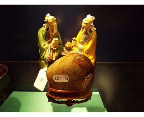 A Chinese jade figure possibly in the form of an elephant and sign in character marks to the side together with a ceramic fig