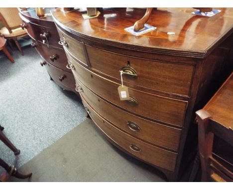 A William IV mahogany cross-banded and ebony strung bow-front chest of drawers of two short over three long graduated cock-be