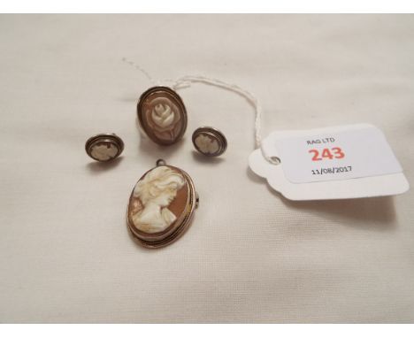A vintage silver cameo pendant and brooch, together with a pair of similar earrings and ring