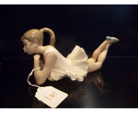A Nao ballerina in laying position, marks to base 