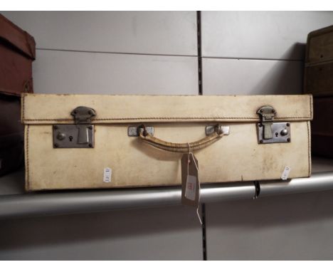 A vintage vellum suitcase