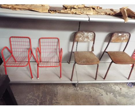 A pair of vintage wooden school chairs together with two red painted metal child's chairs