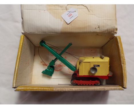 A Dinky Super Toys 'Ruston Bucyrus Excavator' no.975 in yellow, green and red with instructions and box