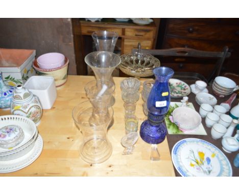 A blue glass oil lamp; four tall glass vases; sundae dishes etc
