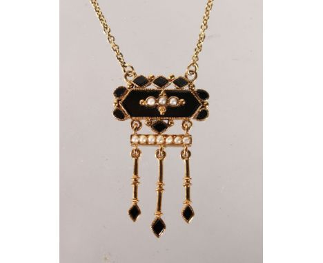 A 9CT GOLD OVAL AND PEARL PENDANT AND CHAIN.
