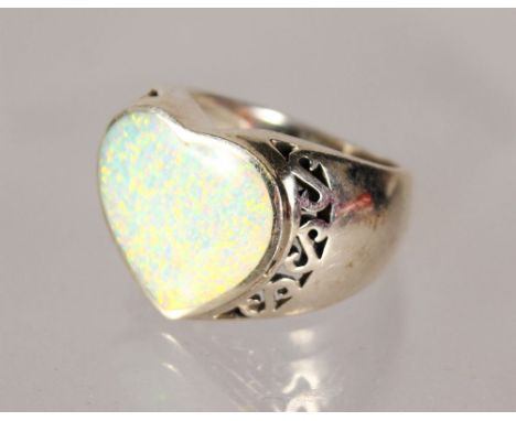 A SILVER HEART SHAPED OPAL RING.