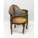 AN 18TH CENTURY FRENCH WALNUT CANE CORNER CHAIR.