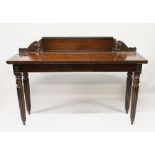 A LATE REGENCY MAHOGANY LONG SERVING TABLE, with shaped back, plain top, on fluted and tapering