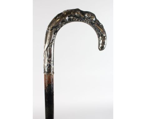 A WALKING STICK WITH CHINESE SILVER HANDLE.