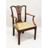 A CHIPPENDALE MAHOGANY ARMCHAIR, with carved cresting rail, padded drop-in seat, on square chamfered
