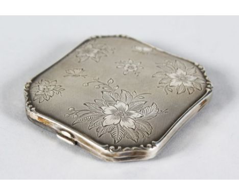 A FRENCH SQUARE ENGRAVED ENGINE TURNED COMPACT engraved with flowers. 3ins x 2.75ins.