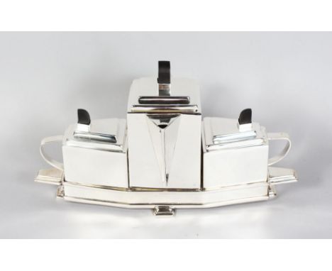 A PLATED THREE PIECE ART DECO STYLE SET, comprising teapot and two basins with ebony finials, in a fitted stand. 14ins long.