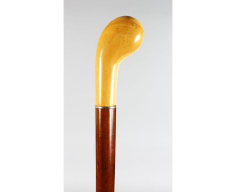 A WALKING STICK with carved IVORY HANDLE.