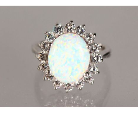 A SILVER GILSON OPAL DRESS RING.