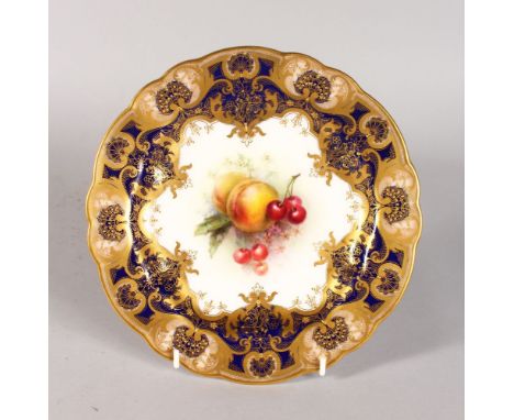 A ROYAL WORCESTER FINE PLATE with cobalt blue border and art nouveau style gilding, the centre painted with fruit by R. Sebri
