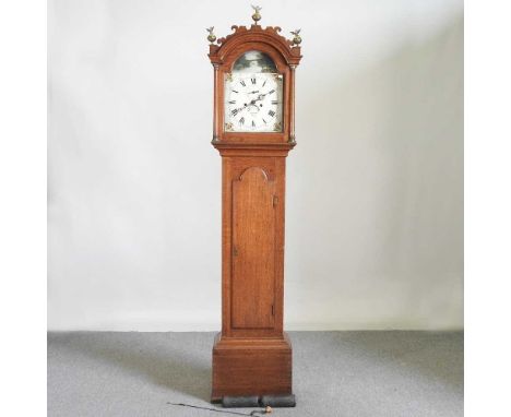 A George III oak cased longcase clock, with a twelve inch painted dial, signed Giscard, Ely, having an eight day movement, 20