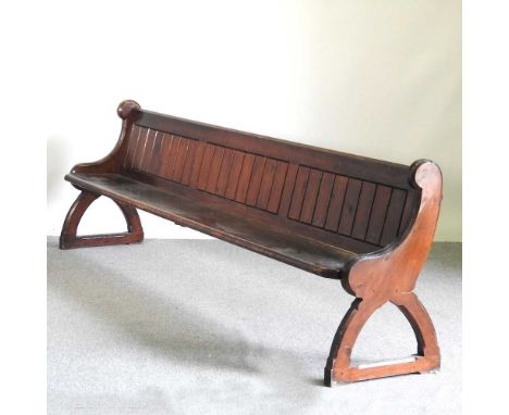 A 19th century stained pine church pew, with a boarded back, 285cm wide285w x 53d x 83h cm