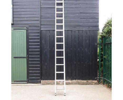 An aluminium extending ladder, 394cm long