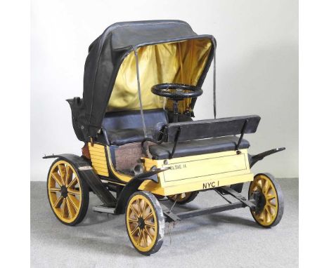 A hand built scale replica of a circa 1902 De Dion Bouton motor car, in yellow, with a folding canopy top and petrol engine11