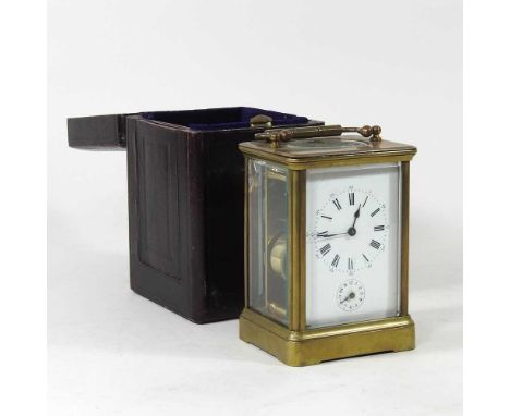 A 19th century brass cased carriage clock, with a white enamel dial, 17cm high overall, in a fitted leather case