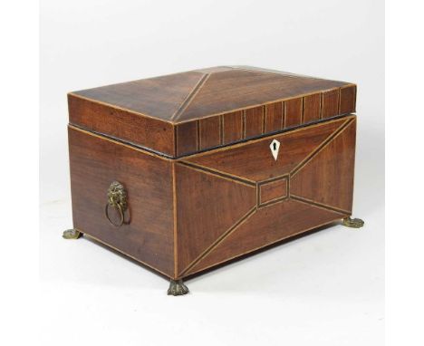 A Regency mahogany and parquetry work box, with a fitted interior, on brass paw feet, 32cm wide. Note: a non-transferable ivo
