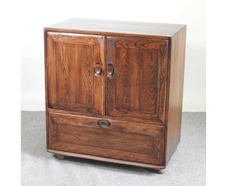 A 1970's Ercol side cabinet, with a pull down door below, 85cm85w x 52d x 94h cmLight oak chest - 84w x 45d x 98h cm