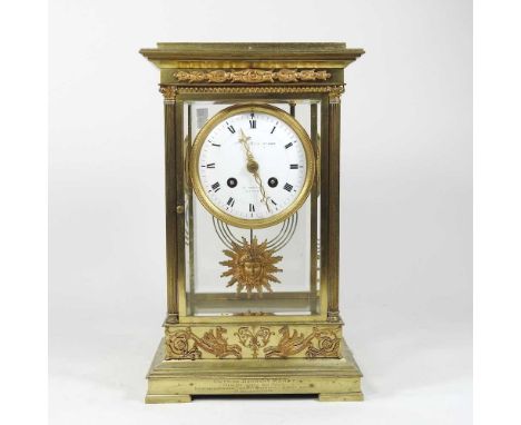 A 19th century French brass cased four glass mantel clock, having a white enamel dial, signed indistinctly and 112 Regent Str