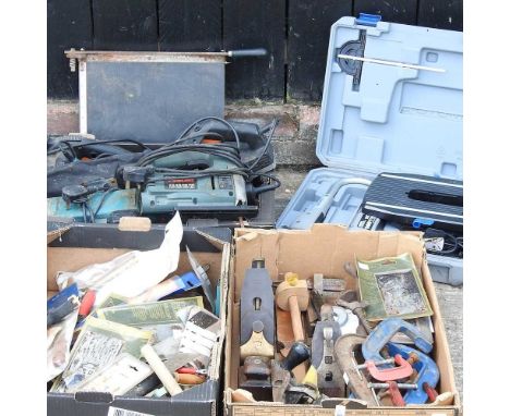 A collection of hand tools, to include an electric Dremel saw, cramps and old woodworking planes