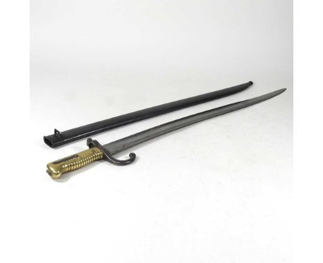 A 19th century French chassepot bayonet, with a brass grip stamped M9912, in a steel scabbard, stamped 33799, 71cm long