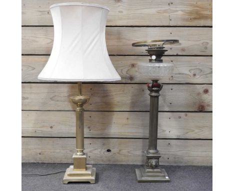 A large brass corinthian column oil lamp, with a coronet top, 70cm high, together with a modern brass table lamp and shade (2