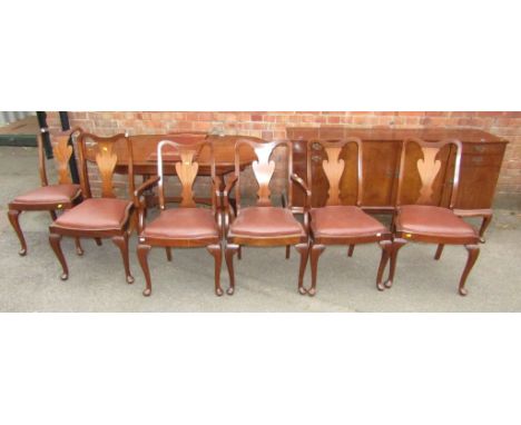 An extending mahogany and line inlaid dining table, Regency style, raised on carved cabriole supports with stretcher below, a