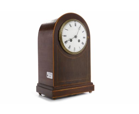 EDWARDIAN MAHOGANY BOXWOOD LINE INLAID MANTEL CLOCKthe circular white enamel dial with Roman numerals, moon hands and two fro