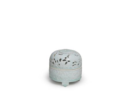 A QINGBAI INCENSE BURNER AND COVERSong DynastyThe cylindrical body with straight sides moulded with a continuous scene of fis