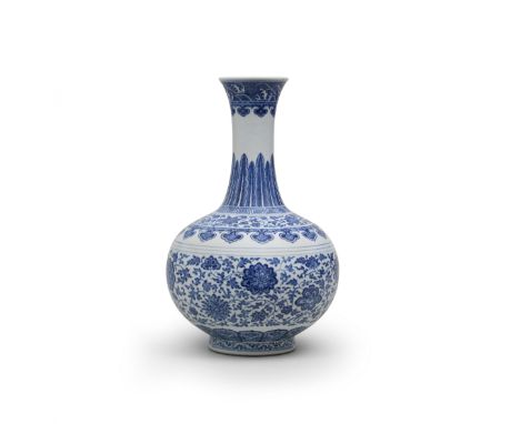 A RARE MING-STYLE BLUE AND WHITE LOTUS-SCROLL BOTTLE VASEQianlong seal mark and of the periodThe globular body painted in ric