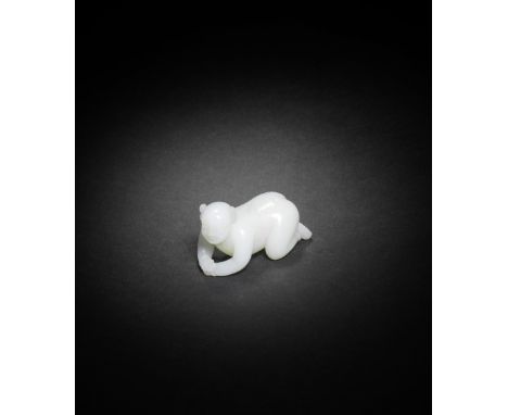 A WHITE JADE CARVING OF A BOY19th/20th centuryFinely carved as an anatomically accurate boy crawling on all fours clad in a d