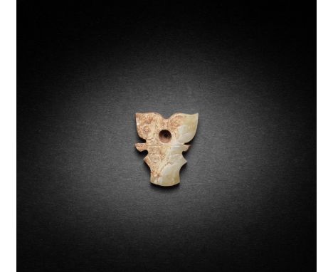 AN ARCHAIC JADE BOVINE PLAQUEShang/Early Western Zhou DynastyThe plaque skilfully worked with two large pointed ears pierced 