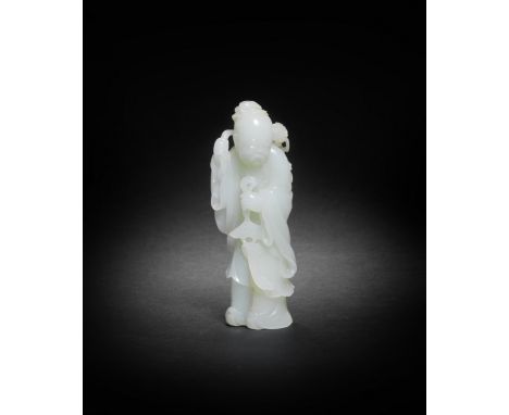 A FINE WHITE JADE CARVING OF A SAGEQianlongCrisply carved as an elderly bearded male figure clad in long flowing robes, his r