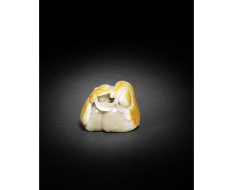 A WHITE AND RUSSET JADE 'CRANES AND PEACH' GROUP17th centuryThe group finely carved in the round as a crane detailed with ove